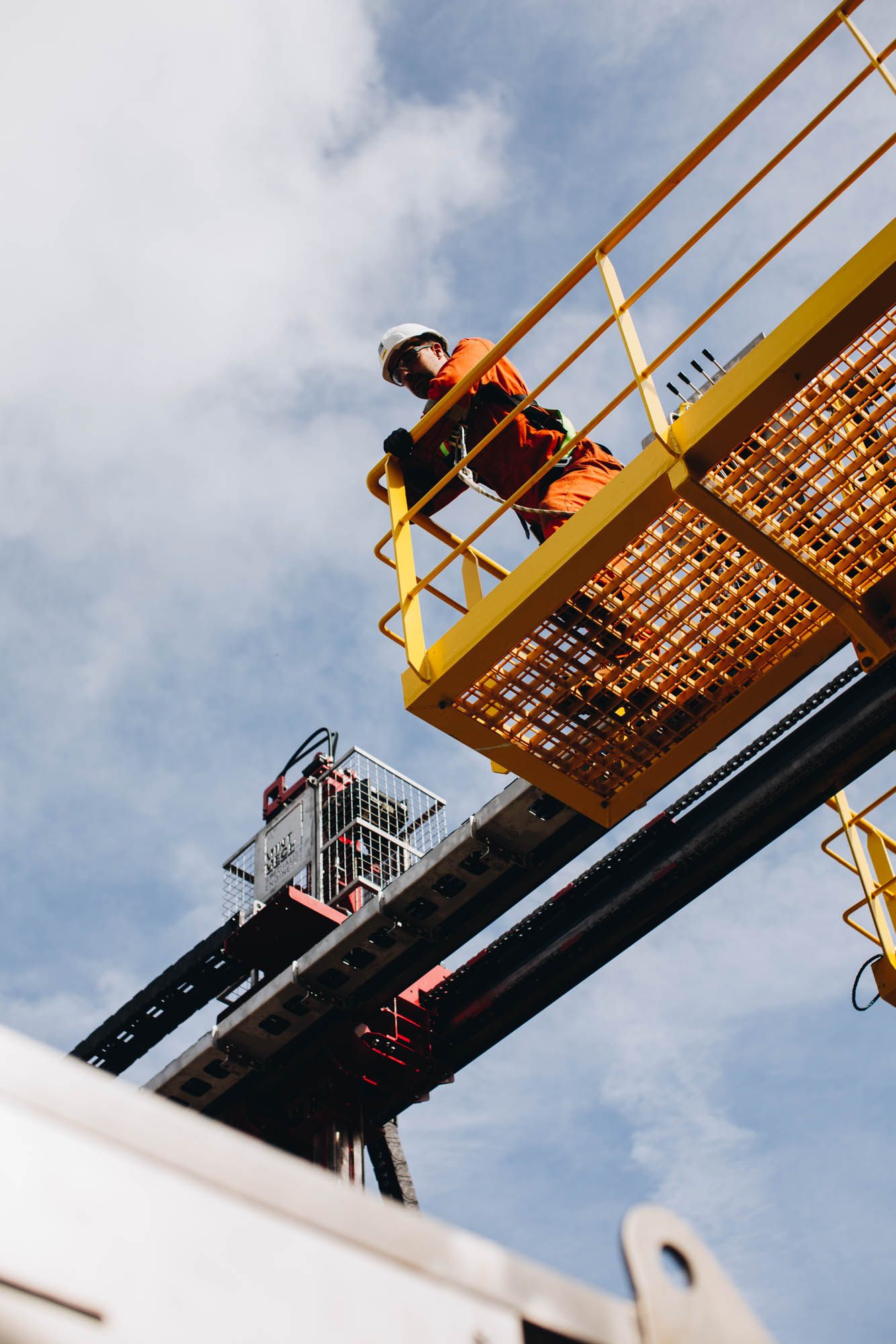 Engineer working at height on an access platform