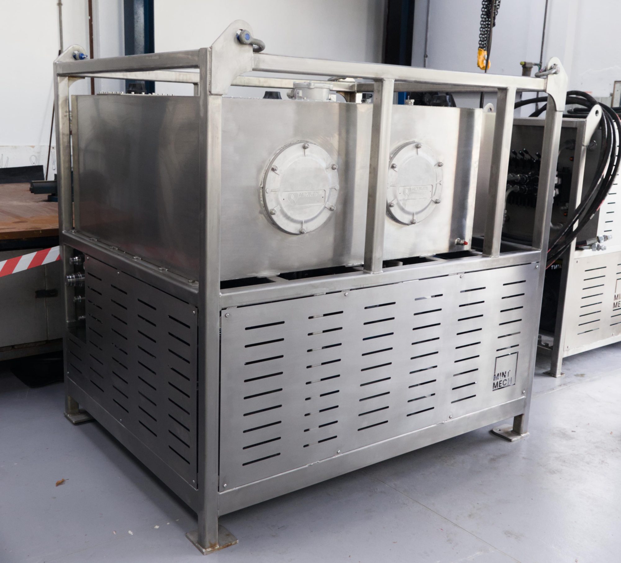 Stainless steel hydraulic power unit in a lifting frame in a workshop