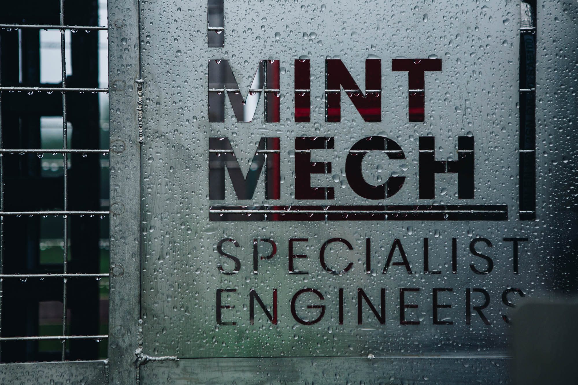 MintMech Specialist Engineers logo on a rain-covered equipment panel
