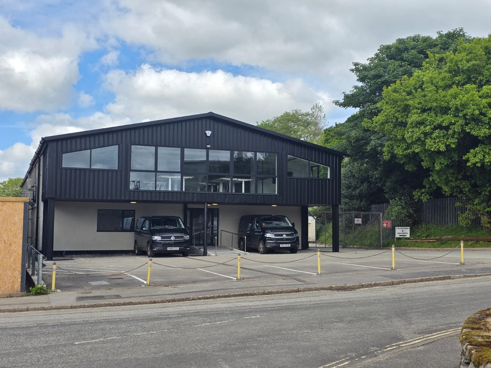 The MintMech facility in Penryn, a dark-clad building with a glazed upper floor