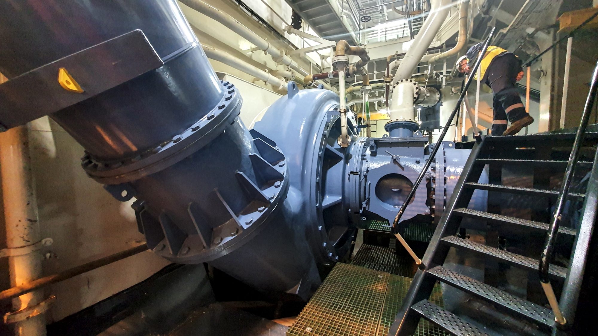 Large dredge pump and discharge pipework inside a vessel's pump room