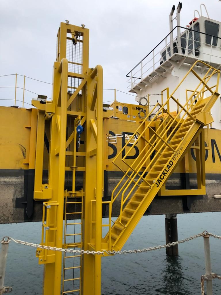 Yellow JackLad 650 boarding ladder and stairway rigged on the side of a vessel