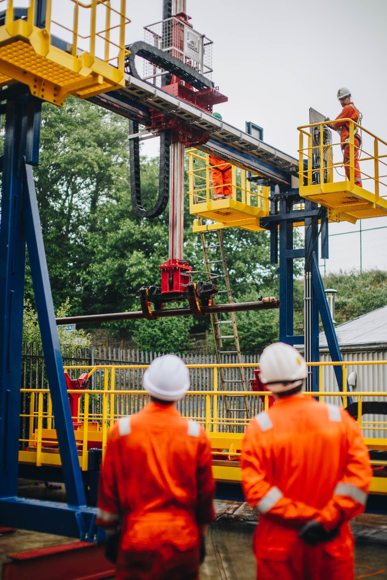 Engineers working at a drilling rig on a live project