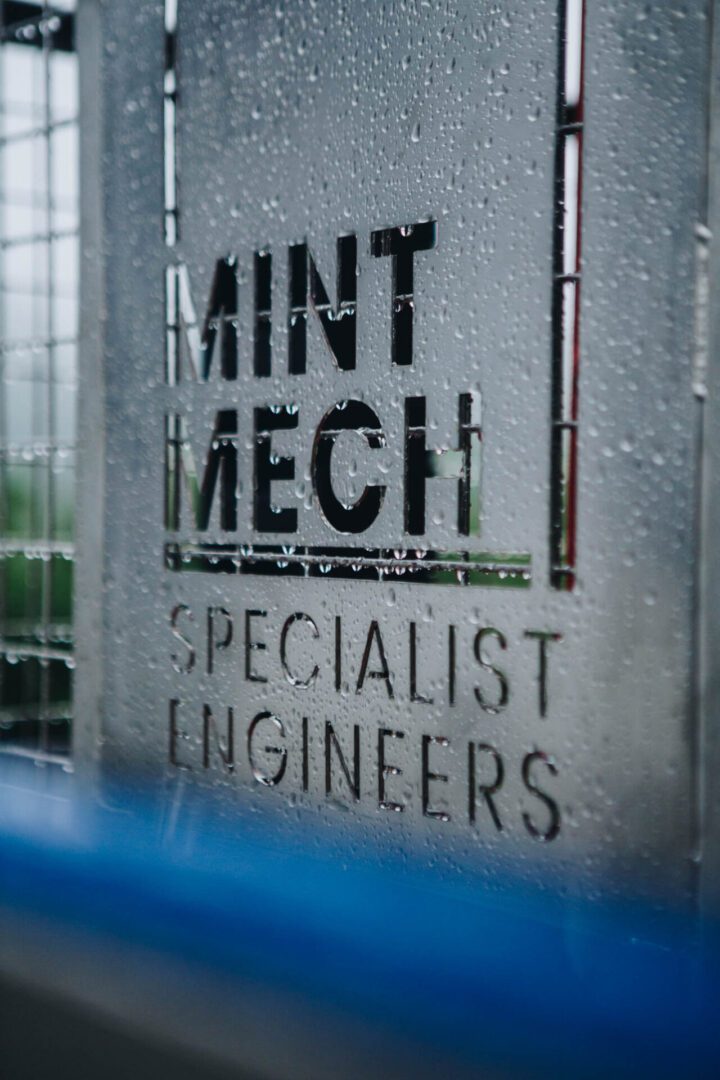 A metal cut out of the logo for MintMech, a specialist engineering company